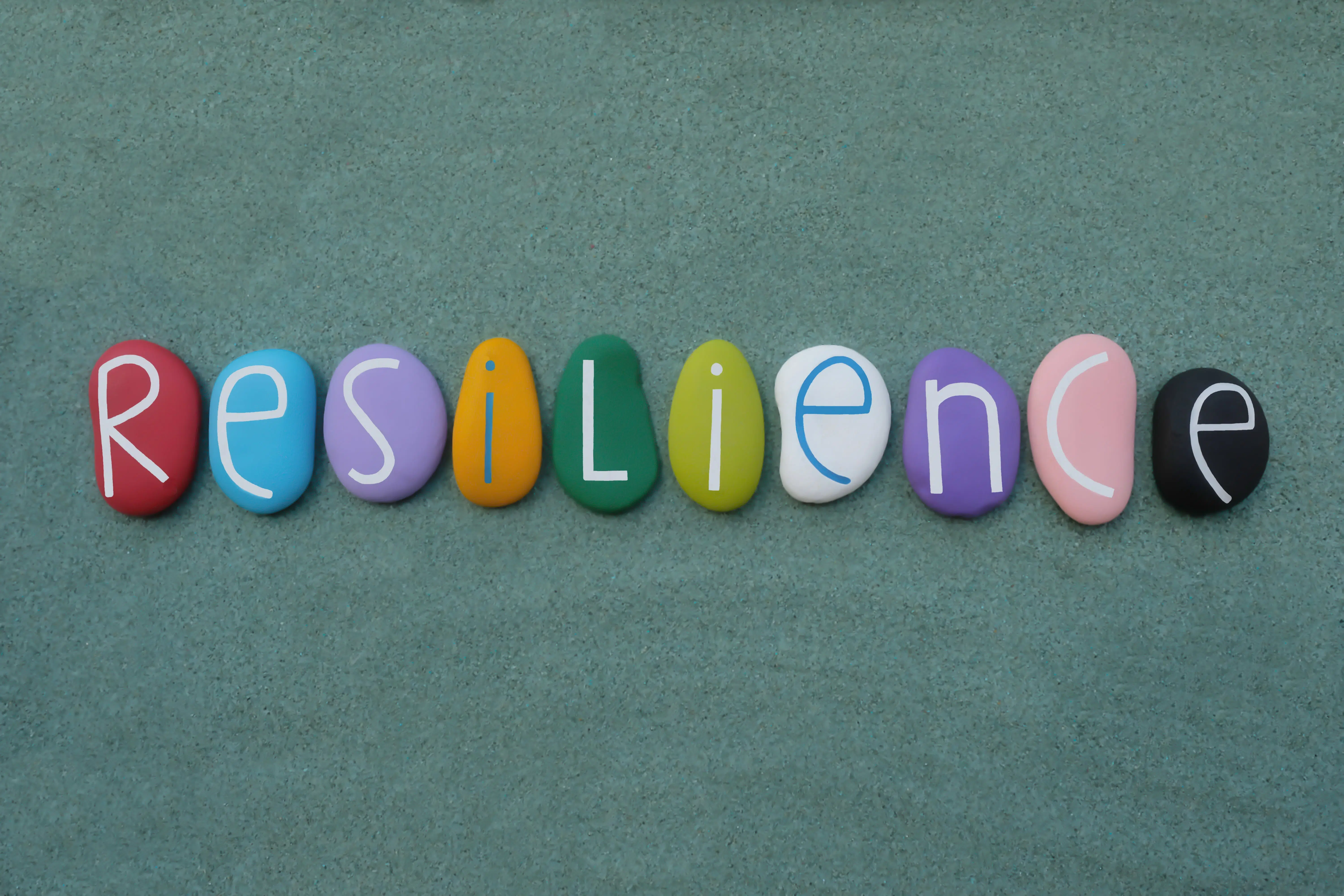 Resilience Written on Colourful Stones To Represent Resilient Foster Parents in Essex and Suffolk