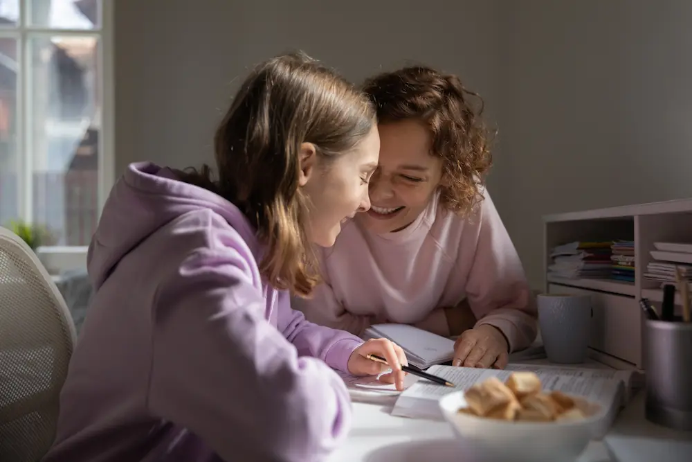 Two people doing school work