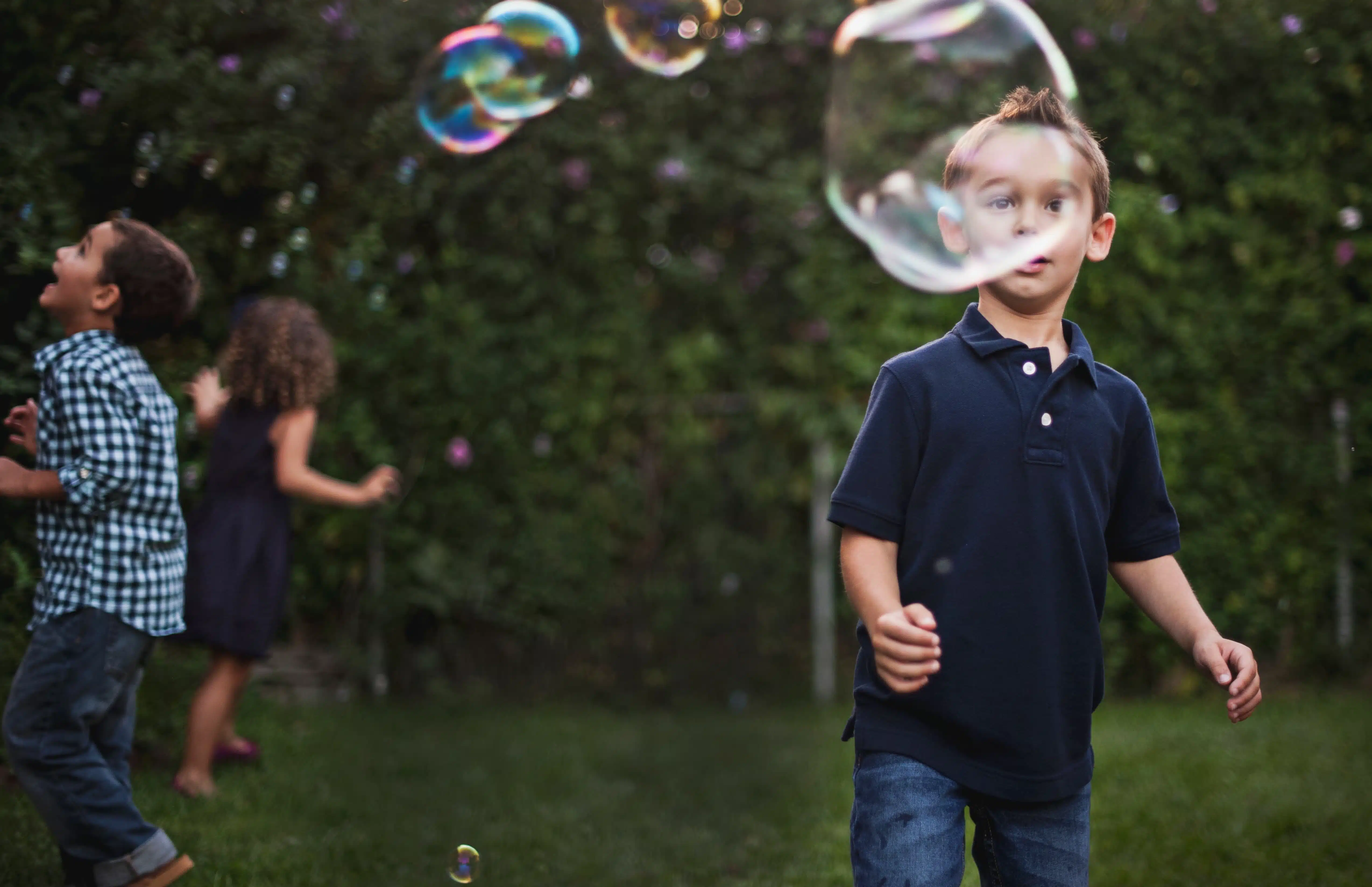 Children Playing With Bubbles